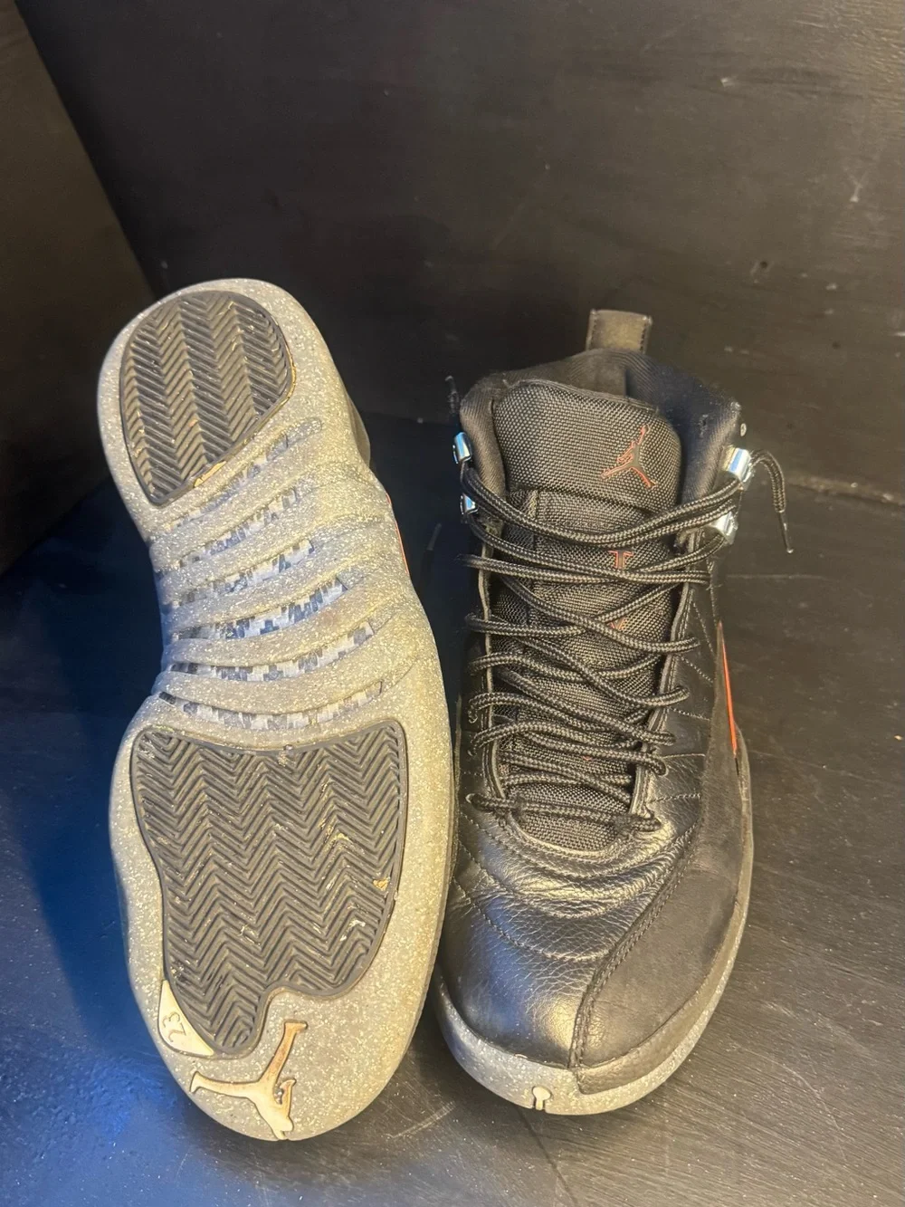 Men's Jordan 12 Black High-Top Athletic Sneakers with Subtle Orange Accent